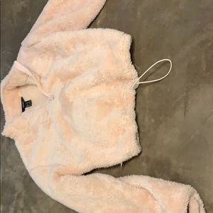 Pink crop top sweater at waist tighten